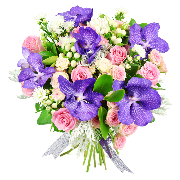 This hand-crafted bouquet, photographed cleanly against a bright white background, showcases a rich interplay of colour, texture, and form that speaks to careful, experienced floristry. Several large Vanda orchids in saturated shades of violet and purple-blue rise gracefully from the design, their broad, slightly curved petals patterned with fine speckles and veins that add depth and movement. Around them, a generous cluster of blush-pink roses and smaller creamy-white spray roses forms a soft, romantic core, with some blooms tightly wrapped like promises and others fully open, revealing layered, velvety petals. Clusters of white hypericum berries provide rounded, glossy accents, while tiny white, daisy-like filler flowers introduce a lightness that keeps the bouquet from feeling too heavy. Silvery Dusty Miller foliage, with its soft, velvety texture, threads through the design, cooling the palette and softening the lines, while rich, dark green leaves frame the outer edges, giving structure and a sense of fullness. The stems are carefully bound at the base with a shimmering ribbon in silver and soft lavender tones, its semi-sheer fabric catching the light and tying together the cooler and warmer hues of the arrangement. The overall effect is refined yet inviting, equally suited to marking an anniversary dinner in a North Watford townhouse, brightening a living room near Garston, or welcoming a new arrival to the family. The bouquet radiates a sense of joyful composure, as though it has been gathered with care from the best stems of the day and prepared for timely local delivery in and around North Watford.