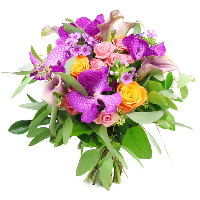 This image showcases a sumptuous hand-tied bouquet, positioned against a clean white background so every detail of the floristry stands out clearly. Dominating the composition are several impressive Vanda orchids, their large, fuchsia-purple petals etched with a fine, speckled pattern that gives them a distinctly exotic character. They form the dramatic focal point, surrounded by lively orange roses that range from compact, tightly furled buds to more relaxed, open cups, each petal layered like a tiny flame. Soft, pastel pink roses and blush-toned garden roses weave gently between these brighter tones, some still in bud and others just beginning to unfurl, creating a romantic, petal-soft transition between the intense purples and oranges. Adding a note of modern elegance, tall, slender calla lilies in muted plum, mauve, and dusky lavender rise gracefully from the heart of the bouquet, their smooth trumpet blooms curling inwards like sculpted ribbons. A generous halo of greenery encircles the flowers: slender, silvery eucalyptus fronds intermingle with darker, glossier green leaves, giving the arrangement a lush, full profile and a cool, fresh backdrop. Scattered through the design are tiny clusters of lavender and lilac filler flowers, their star-like blooms adding fine detail and a cloud-like texture that softens the overall look. The stems are visible at the base, trimmed evenly and bound together, revealing the bouquet as a professionally crafted piece ready for delivery across North Watford. With its rich jewel tones, layered textures, and carefully balanced shape, this arrangement evokes celebration and heartfelt emotion-ideal for marking milestones, enhancing a special dinner near Garston, or bringing a luxurious splash of colour into a modern North Watford home.