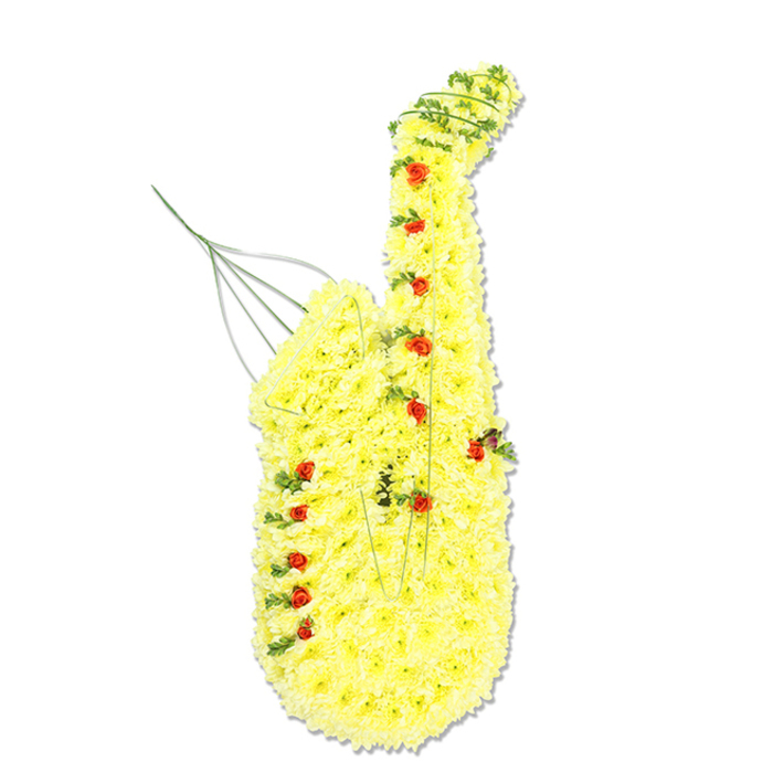 A large saxophone-shaped floral arrangement fills the frame, set crisply against a white background so that every detail of the tribute is easy to imagine. The main body is built from countless yellow chrysanthemum heads, each bloom carefully angled to follow the elegant, sweeping outline of an alto or tenor sax. Their petals create a soft, plush surface that almost looks like velvet from a distance, shifting subtly in tone from pale lemon to rich gold as the light catches different petals. Nestled within this golden expanse are numerous small red spray roses and rosebuds, placed with precision wherever the instrument's keys, valves, or decorative fittings might be, so the viewer can sense the intricate engineering of a real saxophone translated into flowers. Fine threads of dark and mid-green foliage twist and meander along the curves, especially around the neck and the flared bell, suggesting both the metal tubing and the flow of music streaming outward. In places, slim silver or green wires trace subtle lines, reinforcing the structure while adding delicate hints of shine. At the top left, where the mouthpiece would usually sit, an airy wire flourish rises upwards like a final lingering note. The tribute feels bespoke and personal, the sort of design a North Watford family might choose when honouring a loved one who played in local bands, school orchestras, or Sunday jazz sessions in nearby pubs. It offers a balance of brightness and reverence, a floral sculpture that conveys both the discipline of musicianship and the joy their music brought to family and friends gathered to say goodbye.