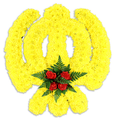 Presented on a stark white field, this Khanda-shaped tribute is constructed entirely from a dense sea of bright yellow chrysanthemums that map every element of the Sikh emblem with careful precision. The circular chakkar is rendered as a continuous ring of tiny, velvety yellow heads; the upright double-edged khanda sword rises from the centre in a slightly raised sculptural ridge; and the pair of crossed kirpans are suggested by sweeping bands of the same sunny blooms. Nestled where those elements converge is a concentrated cluster of five rich, deep red roses, each bud layered like a jewel and embraced by dark green fern foliage that softens the composition and heightens the contrast. The white background and soft shadow beneath make the piece read like a physical, ceremonial object-a wreath or framed tribute suitable for memorial services at local gurdwaras or civic remembrances near Watford Junction and Hempstead Road. The tactile impression is soft and substantial: the chrysanthemums offer a cushiony, almost tactile surface while the roses lend a satin-smooth centre, and the overall aroma is a gentle mix of floral sweetness and green leaf. Crafted with the steady eye of an experienced florist, this arrangement balances bold symbolism with tender intention. Flower Delivery North Watford prepares similar commissions for families across North Watford, often delivered with care to nearby community halls and places of worship.