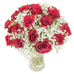 This radiant bouquet, crafted by local North Watford hands, brings together the time-honored passion of red roses with the whimsical airiness of white baby's breath. The generous dome of 18 to 20 roses unfurls in velvety, full-bloomed splendor, each petal deepening in rich crimson hues. Clusters of delicate gypsophila fill the spaces between, their ethereal white blossoms tempering the intensity of the roses and creating a mesmerizing balance. The clear glass vase reveals an artful display of sturdy green stems, reflecting the freshness and care behind every arrangement delivered throughout North Watford-from quiet residential streets near Leavesden Road to the bustling local markets. Gentle daylight illuminates the bouquet, inviting viewers to sense the soft textures and subtle fragrances that mingle in the air. This floral composition is both a visual and emotional masterpiece, designed for moments that call for expressions of deep love, be it an anniversary or a spontaneous gesture. Each arrangement carries the signature expertise of North Watford's skilled florists, ensuring that, wherever it's delivered, it arrives with beauty, meaning, and a whisper of local charm.
