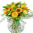 A sunshine-inspired bouquet brimming with the spirit of North Watford, this lively floral arrangement pairs the bold faces of sunflowers with the plush layers of buttery yellow roses. The blooms are thoughtfully gathered in a clear round vase, where the slender green stems twist and curve in seamless harmony, much like the gentle flow of the River Colne nearby. Between each flower, fronds of soft fern and sprigs of delicate filler create feathery textures and shifting shades of green, adding lightness and movement to the scene. Vivid clusters of red hypericum berries burst among the petals, lending a playful touch that enlivens the design, all under a gentle cascade of bluish eucalyptus leaves. The bouquet radiates warmth and happiness, reminiscent of cheerful walks through North Watford's parks on a cloudless day. Every element, from scented roses to crisp foliage, is selected for freshness and beauty, reflecting the local florist's expertise. This arrangement is perfect as a vibrant centrepiece for neighbours gathering, a celebratory gift, or an everyday display that infuses any North Watford space with a naturally joyful energy.