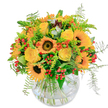Radiating with the sunlit charm that defines North Watford, this bouquet makes every day feel like a celebration. At its centre, golden sunflowers unfurl their bright petals around velvet-brown hearts, exuding the same warmth found on a sunny stroll through Callowland Park. Between them, yellow roses open in creamy swirls, their subtle fragrance carrying the sweetness of a morning garden. The palette is energized by pops of vivid orange and glossy red berries woven through a lush framework of ferns and textured greenery. Each element is carefully placed, creating the impression of effortless abundance and movement-like a burst of wildflowers collected from North Watford's vibrant neighbourhoods. All are gathered in a crystal-clear glass vase, with the clean lines accentuating the artful tangle of stems and the sparkle of fresh water inside. The mood is openly joyful, perfect for birthday wishes, bright thank-yous, or a spontaneous gesture to spread happiness. With every detail, this bouquet embodies the friendly, uplifting spirit of North Watford, thoughtfully arranged for same-day local delivery by florists who know the community and its seasons.