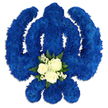 A bold Sikh Khanda floral emblem, crafted as a sympathy tribute, is shown in full detail against a minimalist white background, the simplicity of the setting highlighting its religious importance. Every stroke of the symbol - from the tall central sword to the circular chakkar enclosing it and the sweeping curves of the two kirpans - is completely covered in royal blue chrysanthemums arranged so closely that they form a continuous, textured surface. The small petals overlap and blend, creating a deep blue field that feels velvety to the eye, suggestive of quiet strength and steadfast faith. At the lower centre of the Khanda, where the vertical blade meets the rounded form, a contrasting cluster of white and green is set into the design. Three white roses, perfectly shaped with layered, creamy petals, are framed by delicate white filler flowers, likely baby's breath, and a band of glossy dark green foliage that introduces a gentle, natural rhythm to the viewing experience. Soft, even lighting reveals subtle shadows beneath the emblem, allowing the tribute to appear slightly elevated, as if resting on a table ready to be taken to a Sikh funeral or memorial gathering near the heart of North Watford. Created by local florists for families who wish to express both cultural pride and heartfelt condolence, this Khanda arrangement would sit beautifully in a Gurdwara or chapel, its royal blue blossoms and pure white roses symbolising loyalty, purity of spirit, and a loving farewell.