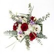There's an immediate sense of thoughtful celebration in this bouquet, as viewed from above-a hallmark of North Watford's unique style. Lush, deep red roses claim the spotlight, their velvety petals both bold and inviting, conjuring feelings of cherished romance and affection that echo through the town's close-knit streets. Radiant white gerbera daisies, each with a striking mocha-brown center, dance in lively contrast beside the roses, while feather-soft clusters of white spray chrysanthemums create a luminous halo of gentle texture. Intersperse these with soft lilac lisianthus, and you find a bouquet that whispers calm and elegance, much like a quiet morning stroll through Garston Park. Generous arcs of silvery eucalyptus, with their rounded satin leaves, add a cool modern twist-a nod to the fresh greenery found in local woodlands-and fill the air with a subtle, invigorating scent. Slender, vibrant greenery threads through the design, adding depth and a sense of layered craftsmanship. Bathed in natural light, each flower and leaf is showcased in radiant detail, making this arrangement ideal for celebratory gatherings or cozy evenings at home in North Watford. The bouquet's careful balance of colour, scent, and texture reflects the experienced touch of local florists, ensuring every gesture of gifting carries with it the spirit and artistry of the community.