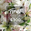 A lush close-up reveals a Florist Choice Bouquet that speaks of luxury and calm. Dominated by pristine white roses in varying stages of bloom, their satin petals meet elegant white lilies with inner petals touched by soft pink. Gentle sprigs of smaller pink blossoms drift through the arrangement, while eucalyptus and other green foliage weave through, adding depth and a cool, natural scent. The bouquet fills the frame with a soft opulence that suggests refined taste and thoughtful gifting, ideal for marking a special moment. A crisp white overlay sits at the center, announcing Florist Choice Bouquet with a stylish balance of script and sans serif typography, and a prominent price readout in bold white numerals, all hinting at premium craftsmanship. This image invites the feeling of a high-end floral presentation from a trusted North Watford florist, ready for same-day delivery across the area. In our local context, it resonates with weddings, anniversaries, or a heartfelt gesture for someone dear in Cassiobury Park, Holywell, or Nascot communities. The overall mood is serene elegance-cool whites, delicate pink accents, and lush greenery that whisper of freshness and care, crafted with meticulous attention to detail that only a long-standing North Watford shop could provide.