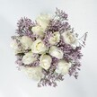 This North Watford bouquet paints a serene portrait: plush, creamy white roses arranged thoughtfully amid a mist of lavender statice, each bloom full and gracious. The roses spill open in gentle spirals, their velvet petals glowing against the cool lilac backdrop, as if reflecting the soft light of a tranquil spring morning over nearby Leavesden Country Park. Wisps of statice branch delicately, their tiny, papery florets casting subtle textural shadows, enhancing the soft interplay of chalky white and lavender that defines the ensemble. The overall mood is soothing and romantic, attuned to both new beginnings and heartfelt moments - perfect for weddings on Hempstead Road, anniversary surprises, or simple tokens of admiration. A powdery floral scent drifts quietly, evoking the refreshing hush of a sunlit Watford home. The arrangement's understated balance speaks of authenticity and lasting affection, thoughtfully designed by a local florist to bring peace, gratitude, and a touch of artistry to any occasion. This bouquet, with its harmonious palette and tranquil air, stands as a gentle promise - a gift ready to comfort and inspire across North Watford.