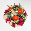 A joyful statement piece, this radiant bouquet overflows with energetic colour and tactile richness-ideal for celebrating life's happiest moments in North Watford. At the core are blazing orange gerberas, their vivid petals capturing every glimmer of light, while plush magenta carnations and sumptuous blush roses create layers of plushness that beckon the senses. Scattered among them, delicate white alstroemeria and tiny, dainty daisies evoke the fresh charm of a dew-kissed morning, reminiscent of early strolls through Garston Park. Abundant, glossy leaves frame the design, adding lush texture without diminishing the bouquet's central vibrancy. Each floral choice, from rose to carnation, is harmoniously blended in a palette that radiates warmth, comfort, and a touch of artistic flair. Infused with a gentle fragrance of spring garden blooms, this arrangement feels perfect for a birthday, an exuberant celebration, or simply as a gesture of renewal for a North Watford home-delivered fresh by local hands who know just how to brighten the day.