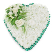 Classic heart-shaped funeral arrangement made up of a dense mass of white chrysanthemums, photographed as if waiting to be delivered to a service in North Watford. The surface of the heart is entirely composed of small, closely clustered chrysanthemum blooms, forming a thick, pillowy cushion of soft white petals with gentle shadows between each flower. This creates a calm, unified background that conveys purity, peace, and heartfelt remembrance. Wrapping neatly around the entire edge is an emerald green satin ribbon, carefully pleated to produce a ruffled, scalloped frame; the ribbon's smooth sheen subtly catches the light, drawing the eye to the precise heart outline without overshadowing the blooms. In the upper left portion of the heart sits a carefully constructed accent spray. Two prominent white roses, fully open and velvety, form the centre of this cluster, their layered petals spiralling outward in elegant curves. Around them are smaller white flowers-likely freesias or similar lightly scented varieties-interspersed with buds that add depth and a gentle sense of newness, even in the context of loss. Lush greenery, including broad, glossy leaves and delicate fern-like fronds, surrounds and supports the roses, with a few fine tendrils resting softly over the chrysanthemum base to break the symmetry just enough to feel natural. The entire tribute is set against a plain white background, so every petal, leaf and ribbon fold is clearly visible, much like you might see it laid out in a peaceful chapel or family home near St Albans Road. This floral heart is a tender, traditional expression of condolences and enduring love at a funeral or memorial.