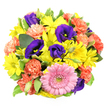 This overhead image shows a lush, circular bouquet laid out against a pristine white surface, every bloom carefully positioned to create a sense of joyful abundance, like a burst of colour arriving at a doorstep in North Watford. At the heart of the design sits a generous pink gerbera daisy, its petals arranged in an even, radiating circle surrounding a textured, greenish-yellow centre that provides subtle contrast. Encircling it, lively yellow chrysanthemum daisies spread their narrow petals outwards, their bright faces evoking clear morning light over the rooftops near St Albans Road. Bold streaks of deep purple and indigo lisianthus weave through the yellows and pinks, some blossoms open wide to show delicate interiors, others still in bud, creating a layered, almost three-dimensional effect. Coral-orange carnations are dotted throughout, their ruffled, feathery petals cascading in soft folds, adding both movement and a warm, celebratory feel. Between these focal flowers, glossy green leaves and hints of variegated foliage with creamy edges break up the colour blocks, framing the blossoms and lending a fresh, garden-like quality, as if just gathered from a local allotment. The tight, dome-shaped composition suggests a hand-tied bouquet crafted with care by Flower Delivery North Watford, ideal for sending congratulations, thanks, or birthday wishes to someone in the area. The balance of sunny yellows, romantic pinks, rich purples, and vibrant corals makes this arrangement feel simultaneously playful and elegant, perfectly suited to brighten homes and offices across North Watford and nearby neighbourhoods.