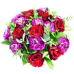 This overhead photograph shows a sumptuous, circular bouquet laid out against a pristine white background, its rich reds and purples forming a striking contrast with the clean surface beneath. At first glance, the most prominent elements are the red roses, around seven or eight of them, spaced thoughtfully through the design. Their petals have a velvety texture that seems almost touchable, folding tightly at their centres and loosening into broad, cupped spirals at the outer edges, where the colour shifts from bright scarlet to slightly deeper, wine-toned reds. Interlaced among the roses is a lush mass of carnations in shades of magenta, fuchsia, and deep purple; their ruffled, serrated petals overlap one another to create a dense, textured canopy that gives the arrangement a sense of depth and luxury. Fresh greenery threads through the bouquet, with soft, round eucalyptus leaves showing a cool, silvery-green hue and larger, darker leaves adding a glossy, forest-green backdrop. Finer stems with small, vivid green leaves break up the darker tones, adding movement and a fresh, garden-like character, reminiscent of the greenery you might see in front gardens around North Watford and along leaveswept roads near Garston. The bouquet is arranged so that it appears perfectly full, rounded, and evenly balanced, suggesting the careful hand of an experienced florist at work in a local North Watford studio. The interplay of passionate reds, regal purples, and calming greens gives the arrangement a mood of romance and celebration, perfect for anniversaries, birthdays, or sending a heartfelt message to someone special in the North Watford area.