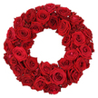 In North Watford, this wreath is a statement of refined romance. A circular braid of dozens of deep red roses forms a lush, uninterrupted ring, set against a pure white backdrop that makes every velvety petal glow. The arrangement is densely packed, with blossoms in several stages of bloom-some fully opened, others still curling into tight spirals-creating a rich tapestry of crimson and texture. The surface feels plush and tactile, as if each bloom were pressed close enough to cradle the next in a continuous, soft embrace.

Up close, the individual petals reveal their delicate folds-the way the edges curl, the way the velvet layers nestle within the flower's heart. The wreath's generous form and the uniform ruby hue speak of balance and care, a sign of a skilled North Watford florist at work. The stems and greenery are tucked beneath the blooms, leaving nothing to distract from the circle's intensity, so the eye reads nothing but a perfect, unbroken ring of red.

This classic design carries a language that fits many moments-love, admiration, beauty, remembrance. It can speak of a romantic gesture, a quiet celebration, or a solemn tribute; its dignity makes it suitable for memorials, ceremonies, or dignified home décor. From our North Watford studio, we ensure this wreath arrives fresh and ready to command attention, with reliable same-day delivery across the area when possible, and memories ready to be shared.