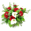 The photograph features a striking floral bouquet of deep red roses and pure white calla lilies, arranged with a florist's precision and shown against a clean, white background that enhances every colour and contour. Viewed from a gently elevated, eye-level angle, the bouquet forms a generous, rounded dome, full and luxurious without looking heavy. At its center, velvety red roses dominate, their petals forming intricate spirals that suggest depth and richness, much like the feeling of a long-lasting romance celebrated in a North Watford home. Nestled between and around these roses, white calla lilies stand with quiet poise, their trumpet-shaped blooms curving elegantly around slender, pale yellow spadices. The lilies' smooth, sculptural petals catch the light in subtle highlights, creating a refined contrast to the textured roses. Surrounding the focal blooms is a lush mix of foliage that includes long stems of eucalyptus with their distinctive, small, round, silvery-green leaves. These add a fresh, airy feel, reminiscent of a cool breeze along the tree-lined streets near North Watford Station after a light rain. Broader, darker green leaves appear throughout the design, deepening the backdrop and emphasizing the bold red and white palette. All the stems are gathered neatly into a clear glass vase, only the ribbed bottom edge visible at the very base of the image, offering a discreet grounding element. The lighting is bright and even, with minimal shadow, allowing every detail of petal, leaf, and texture to stand out. This elegant composition feels ideal for a wedding table near Garston, a Valentine's surprise, or an anniversary bouquet delivered with care anywhere across the WD24 and surrounding North Watford areas.