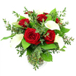 A beautifully balanced bouquet of crimson red roses and pure white calla lilies is showcased in a transparent glass vase, the entire design set before a pristine white background that allows the colours to resonate with quiet intensity. At the heart of the arrangement, several red roses are fully open, each bloom displaying tightly layered, velvety petals that spiral inward to a soft centre. Their deep, saturated red tone immediately conveys romance and depth of feeling, like an intimate gesture shared on a quiet evening in North Watford. Rising between the roses, four to five white calla lilies add a tall, statuesque elegance. Their trumpet-shaped blooms are smooth and waxy to the eye, folding in graceful curves around a pale amber or yellow spadix that glows subtly against the white. A mix of greens surrounds and supports these flowers: feathery eucalyptus stems introduce silvery-blue, rounded leaves that soften the outlines of the arrangement, while larger, more robust emerald foliage gathers at the base, framing the blooms and giving the bouquet a full, rounded silhouette. The cylindrical glass vase, with a delicate ribbed detail at its base, reveals the straight green stems lined neatly in clear water, a visual reminder of the flowers' freshness and careful preparation. The lighting is bright and even, highlighting the glossy sheen on the lilies and the rich texture of the rose petals without casting strong shadows. This composition feels serene yet celebratory, the sort of bouquet chosen for an anniversary meal at home near North Watford High Street, a Valentine's delivery across nearby districts, or simply as an elegant statement of appreciation that brings a touch of luxury to any room.