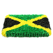 In this photograph, a beautifully crafted floral panel recreates the Jamaican flag as a dignified funeral tribute, its colours and textures rendered entirely in fresh blooms. The arrangement is a solid rectangle with clear thickness, so it seems more like a piece of floral art than a flat spray. At its heart, a bold golden-yellow X stretches from corner to corner, formed from countless small yellow flower heads packed so closely that they create a soft yet sharply defined diagonal cross. Between these bands, the top and bottom triangular sections are composed of leafy green flowers, their ruffled petals layering into a dense, cushion-like surface that suggests vitality and renewal. On the left and right, rich black blossoms complete the flag's pattern, their velvety texture gently absorbing the light and adding a sense of gentle solemnity and strength. Each section is carefully blocked so the colours meet in clean lines, reflecting the steady hand and practiced eye of an experienced florist. The piece is photographed against a bright white background with even, diffused lighting, which brings out the intensity of the green, yellow, and black without harsh glare, and highlights the intricate interplay of shadows between the petals. You can almost imagine the faint, earthy scent rising from the flowers, and the quiet hush of a farewell service somewhere in North Watford, perhaps near Cassiobury Park or along the peaceful residential streets. This tribute feels perfectly suited for honouring someone with Jamaican heritage, offering a powerful symbol of identity, remembrance, and love.