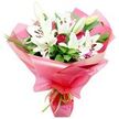 A lavish bouquet of white Oriental lilies and deep red roses is shown in crisp detail against a pure white background, allowing every petal and leaf to be clearly seen as if displayed in a North Watford florist's studio. Several large lilies dominate the arrangement, their wide, trumpet-shaped flowers fully open, revealing satiny white petals and prominent stamens with dark, cocoa-brown anthers dusted in fine pollen. Some lilies are still in bud, elongated and pale green with a hint of cream at the tip, conveying a sense of freshness and longevity. Nestled closely between these lilies are numerous red roses, many in tight bud or just beginning to open, their velvety, deep crimson petals forming intricate spirals that radiate classic romance. The bouquet is enriched with plentiful dark green foliage; broad, glossy leaves provide a strong, structured base while slender, grass-like fronds arc gracefully, adding texture and movement reminiscent of the greenery along North Watford's quiet residential streets. All the stems are wrapped in an ample layer of glossy, bright pink cellophane or floral paper that fans out around the blooms in soft, translucent waves, catching and reflecting the light to give the arrangement a cheerful, celebratory glow. At the gathered base, a slim lime green ribbon is neatly tied in a small bow, its fresh, zesty colour echoing the foliage and adding a playful finishing touch. The overall mood of the bouquet is one of heartfelt celebration and appreciation, ideal for delivery across North Watford to mark an anniversary, a birthday, or simply to bring a burst of elegance into a home near Watford town centre.