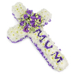 A dignified, cross-shaped funeral tribute captured against a clean white backdrop: the entire body of the cross is built from tightly packed, snow-white chrysanthemum heads that form a pillowy, reverent surface. Along the outer edge, a ruffled purple satin ribbon is woven with careful pleats, its rich lilac-to-deep-violet tone tracing the silhouette and lending a quiet, solemn flourish. Running down the vertical arm, the name MUM is spelled in clearly defined letters made from smaller purple flower heads-likely lisianthus or compact spray chrysanthemums-so the inscription reads boldly yet tenderly against the white cushion of blooms. At the centre where the arms meet, a lush, compact spray becomes the visual heart: deep violet roses with tightly furled petals sit beside softer lavender lisianthus and eustoma, their ruffled edges softening the composition. Variegated foliage-light-margined green leaves with darker centres-fans gently through the cluster and small round green berries punctuate the texture, adding natural contrast and depth. The overall palette of pristine white and layered purples, from pale lavender to dusk-like violet, suggests purity, mourning, and gentle dignity; the finished piece feels both substantial and consoling. The arrangement is lit with soft, even studio light that accentuates petal texture and ribbon sheen, and there is a faint, powdery floral scent reminiscent of spring rain. As a local maker familiar with North Watford's quieter streets and memorial services near Cassiobury Park and Vicarage Road, I designed this tribute to speak of loving remembrance and calm respect, a comforting emblem to place by the coffin, at the service, or at the graveside.