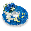 A serene, circular funeral wreath composed of a dense ring of vivid, royal-blue chrysanthemum blooms, each small, spidery petal layered to create a textured, velvety surface that reads almost like a soft fabric. The wreath sits on a crisp white field of light, the inner edge trimmed with ruffled, pleated white satin that lifts and frames the blue like a pale, quiet halo. At the upper-left curve, three large blue roses open fully, their petals plush and satiny with a deep sapphire tone that echoes the chrysanthemums but reads richer and more opulent. Around those roses, tiny sprays of white baby's breath lend a whispering, cloud-like contrast, while a few dark green leaves ground the cluster with natural shadow. From the mid-left the eye follows a gentle cascade of pure white orchids-Phalaenopsis-like blooms with broad, delicate petals-arching toward the lower right; interspersed among the open orchids are pale green buds at varying stages, some tight and hopeful, others just beginning to unfurl, suggesting continuity and quiet renewal. The overall composition is balanced and composed with the restraint appropriate to a memorial: cool blues that speak of calm, contemplation, and enduring memory, set against immaculate white that implies purity and peace. Soft, diffused studio light gives the petals a subtle sheen and lets the textures read clearly without glare. As a local florist's careful tribute for North Watford families-near Cassiobury Park and Watford High Street-this wreath conveys dignified sympathy, a tactile and visual expression of love and remembrance for a loved one.