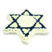 This image shows a carefully designed Jewish funeral tribute in the form of a six-pointed Star of David, composed entirely from tightly clustered fresh flowers. The star stands alone against a pure white background, drawing attention to its precise, architectural shape and the rich interplay of colour. A broad edge of white chrysanthemums defines the outer outline, each small, many-petalled head contributing to a soft, velvety texture. Inside this outer band, the central hexagon and six inner triangular sections are also made from white blooms, so that the middle of the arrangement feels tranquil and pure, like a quiet space for prayer or reflection. The remaining sections of the star, forming two interlocking triangles, are filled with deep navy blue flowers, which clearly carve out the familiar Magen David motif. This dark blue creates a bold contrast, similar in spirit to the blues seen in tallit prayer shawls, giving the arrangement a sense of tradition and rooted faith. The overall effect is solemn yet comforting, well suited to a Jewish funeral, shiva house, or memorial service around North Watford. The regularity of the flower heads and clean lines of the star show the skilled hand of a professional florist, likely from a nearby workshop serving families across North Watford, Bushey, and surrounding neighbourhoods who wish to honour a loved one with a respectful, culturally meaningful floral tribute.