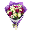 In this photograph, a joyful, hand-tied bouquet is presented upright against a simple white background, allowing every colour and texture to take centre stage. The flowers form a generous, rounded crown, tapering into a neat bundle of stems at the base, the sort of bouquet you might imagine being carried down a quiet North Watford side street for a surprise doorstep delivery. At the core are creamy white roses, their tightly layered petals still fresh and dewy, bringing a soft, luminous quality to the design. Encircling them are deep magenta carnations, their many ruffled petals overlapping like fine fabric, creating a rich, velvety halo of colour. Threaded throughout are white alstroemeria, each slender petal patterned with subtle pinkish-red streaks and finished with dark stamen, giving the bouquet intricate detail when viewed up close. Between the blooms, lush green foliage fans out, some leaves showing light variegation along the edges, adding a sense of movement and natural abundance reminiscent of local greenery around parks and residential gardens in North Watford. The stems are dressed in a layer of crisp white paper that hugs the base of the blooms like a clean collar, while an outer wrap of translucent purple cellophane or tissue flares outward, its crinkled surface catching highlights and echoing the jewel tones of the carnations. Everything is cinched at the base with a bright, iridescent green satin ribbon tied into a careful bow, from which a small, pale rectangular gift tag dangles, blank and ready to be inscribed with a personal sentiment. The overall effect is one of joy, affection, and celebration, ideal for birthdays, anniversaries, or simply sending warm wishes within the North Watford community.
