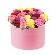 From Flower Delivery North Watford, this elegant arrangement speaks of celebration and refined romance. A round pastel pink hat box, its surface softly velvety to the touch, sits against a pristine white backdrop as if photographed in a quiet studio. The lid curves gracefully, revealing a lush, densely-packed domed bouquet that overflows with dozens of freshly bloomed roses. The palette is a sunny spectrum: deep crimson red, rich magenta, bright yellow, playful bubblegum pink, and bi-color blossoms that fade from pale pink into creamy white. Each rose looks perfectly formed, with smooth, flawless petals that signal peak freshness and careful handling. A whisper of green foliage peeks between the blooms, enough to frame the colour fiesta without stealing the spotlight. This elegant flower box reads as a premium gift-ideal for romance, heartfelt thanks, or a celebratory moment-yet versatile enough to brighten any room. In North Watford, similar arrangements delight customers from North Watford High Street to leafy residential streets near Cassiobury Park, often available for same-day delivery or next-day courier service. The image suits features on premium flower delivery, special-occasion bouquets, or Mother's Day and Valentine's Day selections, while also standing as a refined interior accent for home decor articles. It speaks of skilled floristry, long-term freshness, and a generous sense of luxury that keeps the bouquet looking abundant from every angle.
