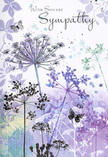 This North Watford sympathy card reads visually like a soft-spoken poem, opening to reveal a cluster of airy wildflowers and butterflies drifting through a cool, calming palette. Slender, gently curving stems reach upwards from the base of the design, their umbelliferous heads drawn as fine, intricate silhouettes in lavender, indigo, and powdery blue, as if captured in the last light over Garston or along the quiet residential streets off North Western Avenue. The flowers have a weightless quality, their tiny florets only lightly suggested, giving them the appearance of meadow blooms swaying in an evening breeze. Behind them, layers of watercolour wash across the card in subdued tones of lilac, soft silver-grey, and blue-green, blending together without hard lines, like mist settling over distant trees. Here and there, pale butterflies float among the blooms, their wings just hinted at with faint strokes of colour, evoking transformation, gentle presence, and the idea that love and memory continue even when someone is no longer physically with us. The mood is contemplative and serene, not dramatic or showy, making it a kind, thoughtful companion to understated condolence flowers. As florists serving the North Watford community, we often see this card chosen by those who want to express sympathy with grace and quiet honesty, whether sending it alongside a simple lily sheaf, a natural woodland spray, or a soft pastel bouquet delivered to a family home after the funeral. It offers a tender balance of beauty and restraint, letting the message of care come through in every delicate line and muted shade.