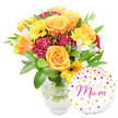 A bright, tender gift set captured on a pure white background: a generous bouquet in a clear glass vase sits slightly left of centre, its water and green stems visible and crisply lit as if caught in soft morning light. The arrangement reads warm and joyful-peachy-orange roses with full, spiraled petals form the heart of the design, their velvety faces edged with gentle highlights. Scattered like little suns among them are yellow gerbera daisies with dark centers, their flat, cheerful disks lifting the composition. Deep burgundy carnations add plush, ruffled density and a velveteen contrast that grounds the brighter tones, while delicate white alstroemeria (Peruvian lilies), slender and subtly speckled, thread through the bouquet to introduce a light, lyrical air. A variety of glossy foliage-broad green leaves and finer sprigs-envelops the flowers, giving the bouquet a garden-fresh frame and a cool, vegetal scent that balances the sweeter floral notes. At the lower right, slightly overlapping the vase, a round white foil balloon introduces a playful, celebratory note: its surface is freckled with metallic gold and fuchsia polka dots and tiny hearts, and at the centre Best Mum is written in flowing hot-pink cursive, the lettering bright and affectionate. This composition reads as a thoughtful Mother's Day or birthday offering: tactile petals, contrasting textures, and a personalised balloon that make the gift feel intimate and well-made. It's the sort of bouquet someone might pick up after a stroll through Watford High Street or while pausing in Cassiobury Park, intended to arrive smelling fresh and looking exuberant for a much-loved mum.