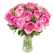 A lush, domed bouquet of roughly two dozen freshly cut pink roses sits in a simple, clear glass vase, the kind we often arrange for bedside tables and anniversary surprise deliveries across North Watford. Each bloom is captured in a gentle gradient of colour: cores of deep fuchsia or magenta that soften outward into blush pink and sometimes the palest creamy white at the outermost petals. The roses are arranged tightly so their rounded heads form a full, symmetrical silhouette; between them, glossy dark-green leaves peek through and add a cool, tactile contrast to the satiny petals. Through the transparent vase the straight, trimmed green stems are visible, submerged in clean water that catches the bright, even studio light and gives the composition a sense of freshness and clarity. Under that lighting every fold and spiral of each rose petal is defined, suggesting the velvet texture of the petals and the faint, sweet fragrance that seems to hang in the air - a scent that calls to mind an early summer morning in a private garden near Cassiobury Park. The overall mood is intimate and celebratory, conveying affection, comfort, and quiet luxury. This arrangement reads as an expert florist's statement of care: perfect for anniversaries, Mother's Day, birthdays, or as a heartfelt thank-you to someone special in the community around Watford High Street and the area near Watford Junction.