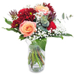 The moment this bouquet enters a room in North Watford, it immediately commands attention with its artfully arranged hues of deep burgundy and soft peach. At the heart sit three luminous, peach-toned roses, their petals delicate and full of warmth-a subtle nod to romance and comfort found in North Watford's welcoming cafés and tree-lined streets. Surrounding these, opulent burgundy chrysanthemums provide a sense of depth and layered richness, their ruffled petals thick and tactile, adding a dramatic presence to the arrangement. Clouds of baby's breath drift gently around the bold colours, their tiny white blossoms creating a sense of lightness and celebration, like the soft music of a local festival. Glossy foliage and sprigs of eucalyptus pierce the design, their aroma hinting at green open spaces and brisk autumn mornings nearby. The bouquet is grounded in a clear glass vase-its organic tangle of stems visible, promising freshness and authenticity. This thoughtful arrangement, suitable for heartfelt birthdays or meaningful romantic gestures, weaves together the unique spirit of North Watford with timeless elegance, ready to brighten the day of anyone who receives it.
